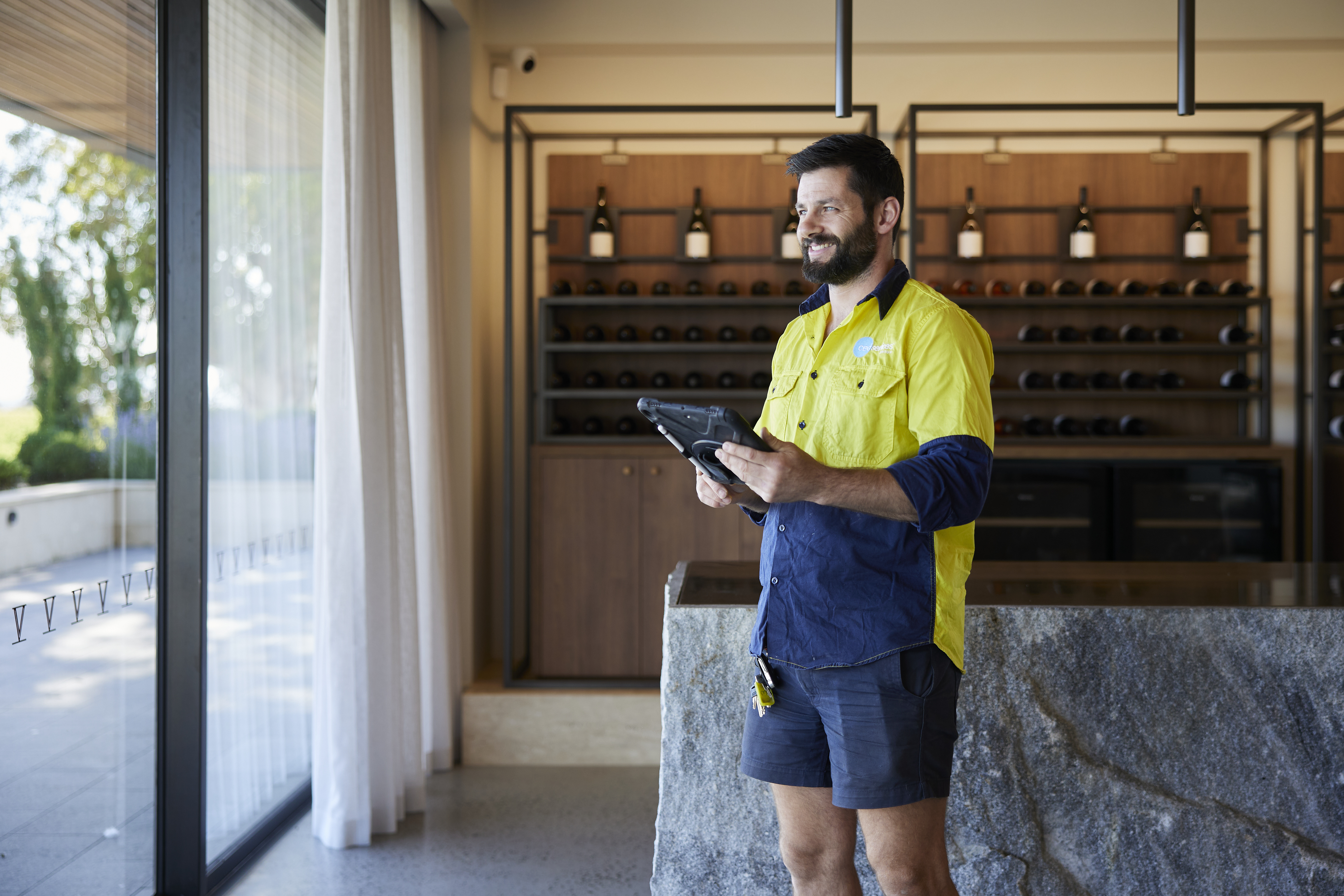 CED Security technician using a tablet to check a system on site