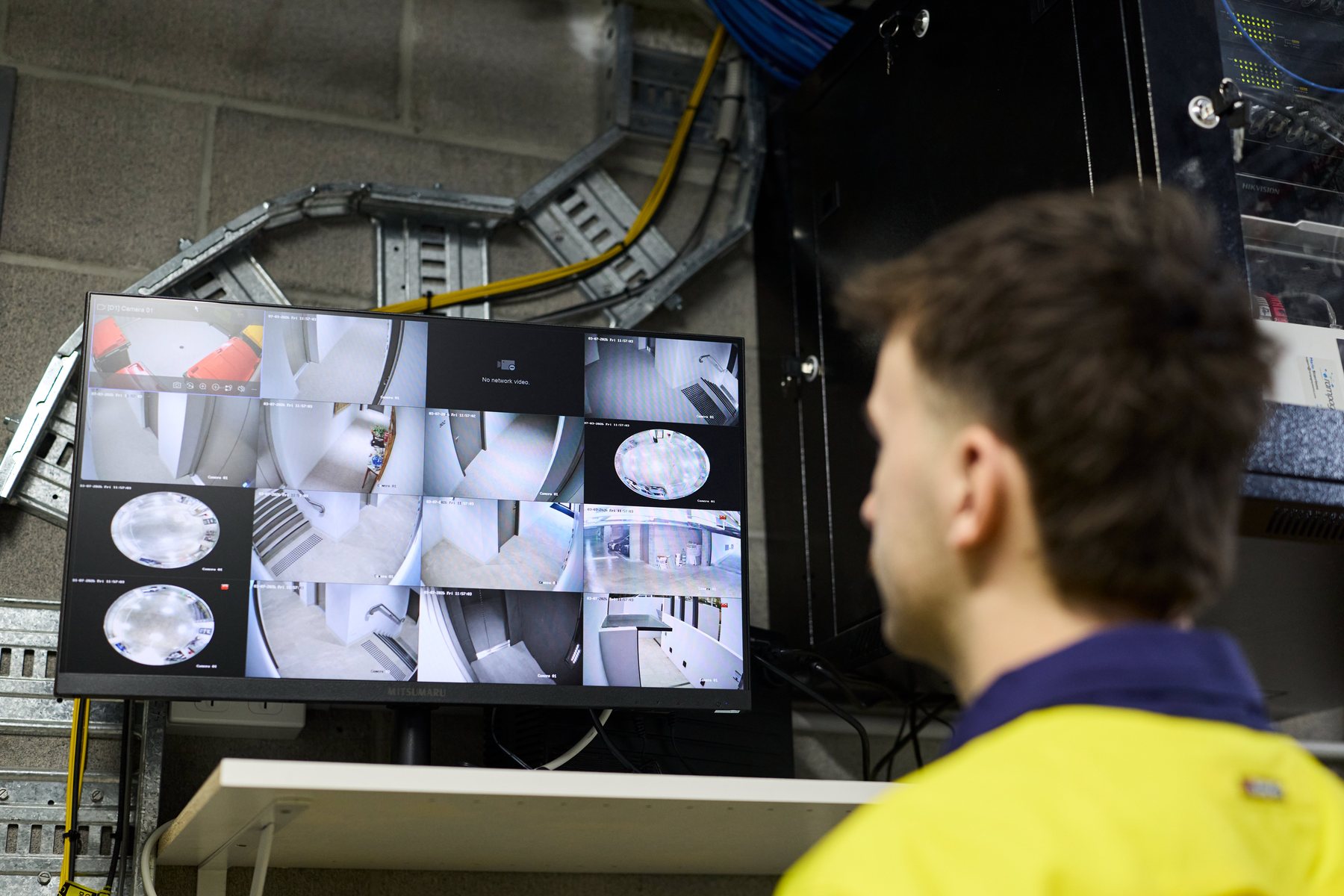 CED Security technician reviewing CCTV footage on a monitor